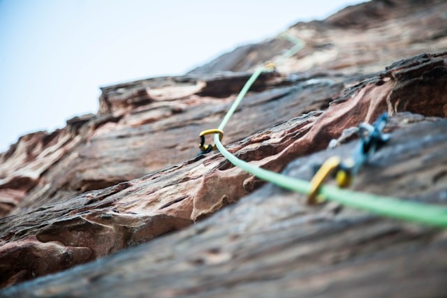 selective-focus-photo-of-green-climbing-safety-rope