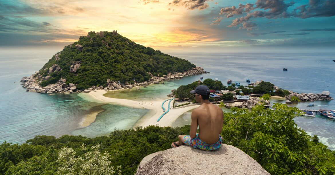 topless-man-sitting-on-cliff-rock-viewing-ko-nang-yuan-isalnd