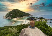 topless-man-sitting-on-cliff-rock-viewing-ko-nang-yuan-isalnd