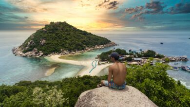 topless-man-sitting-on-cliff-rock-viewing-ko-nang-yuan-isalnd