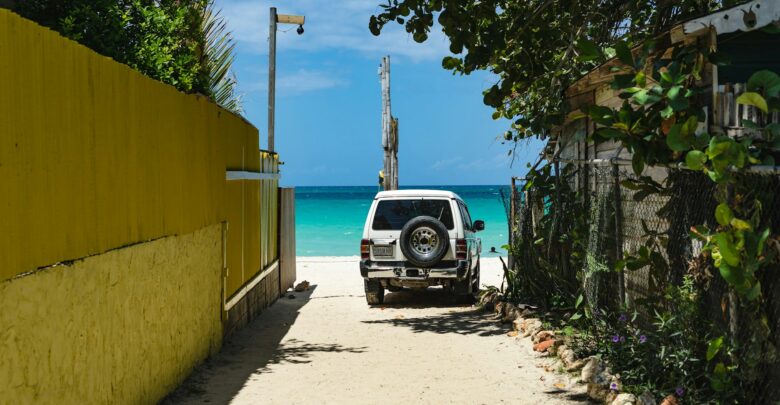 black-car-parked-beside-yellow-building