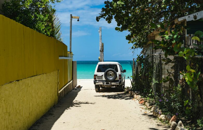 black-car-parked-beside-yellow-building