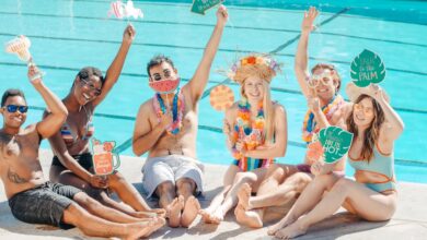 people-having-fun-while-sitting-on-the-poolside