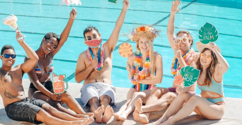people-having-fun-while-sitting-on-the-poolside
