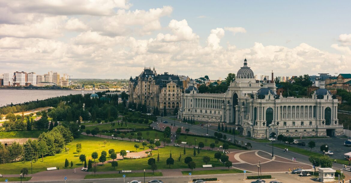 a-view-of-a-large-building-with-a-lot-of-cars-parked-in-front-of-it