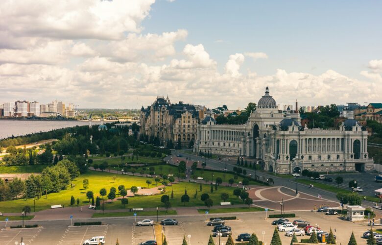 a-view-of-a-large-building-with-a-lot-of-cars-parked-in-front-of-it