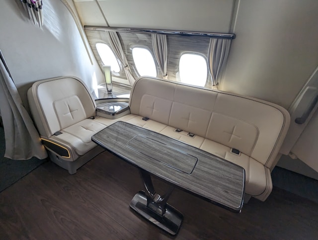 the-inside-of-an-airplane-with-two-seats-and-a-table